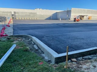 concrete curb around parking lot